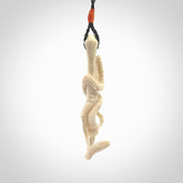 Hand carved deer antler skeleton hand with snake pendant. Hand carved by NZ Pacific. Free postage worldwide. Hand made skeleton hand with snake necklace from deer antler. Skeleton hand with snake necklace for men and women.